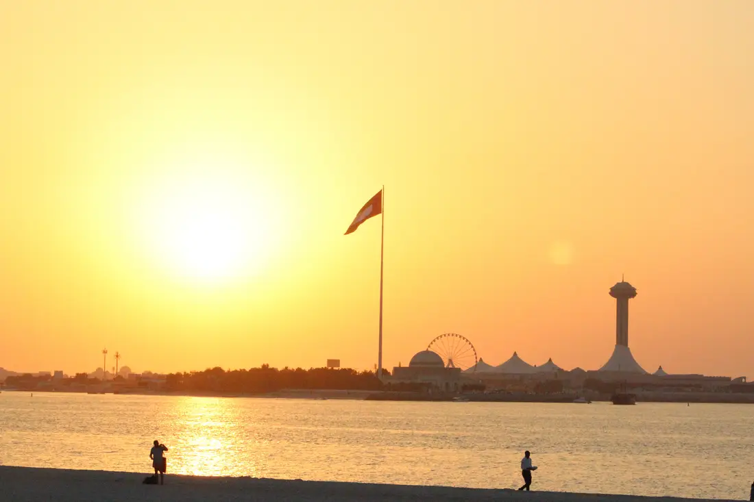 Sun setting over the water at Abu Dhabi Corniche